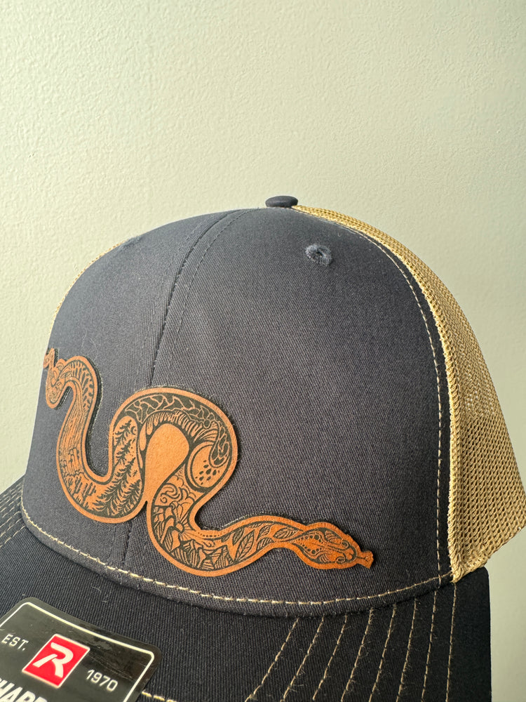 Snake patch trucker hat